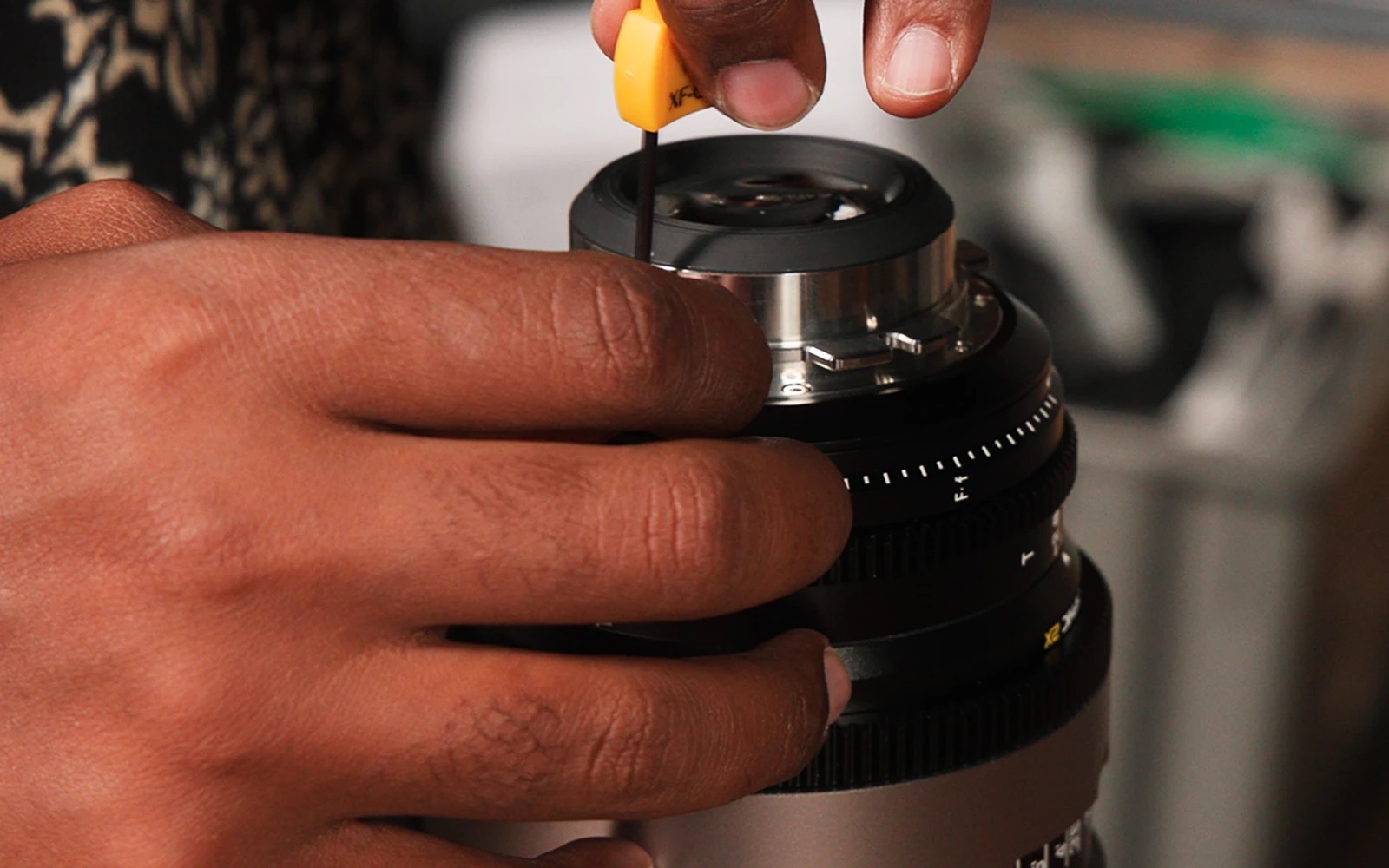 A lens mount being changed with a hex key